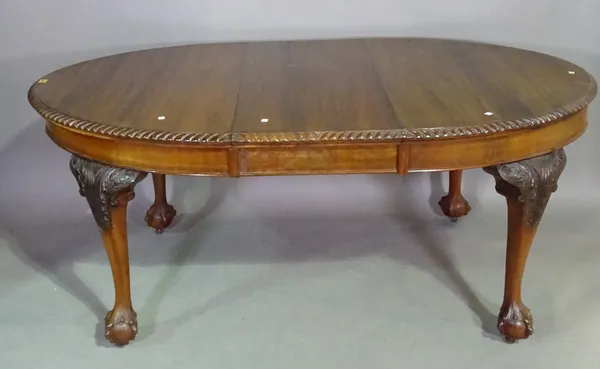 A Victorian style mahogany extending dining table on ball and claw feet and six chairs, 170cm long x  78cm high.  I6