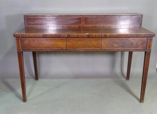 A George III inlaid mahogany stage back serving table, with four side drawers on tapering square supports, 153cm wide x 103cm high x 72cm deep.  J9