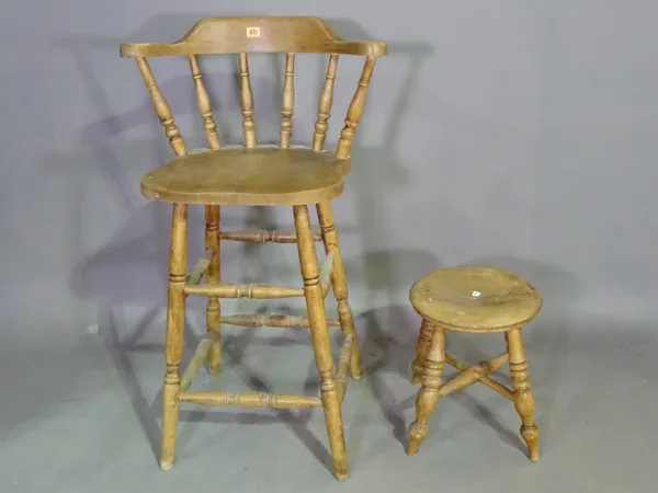 An early 20th century pine bar back stool and a pine circular stool on ring turned supports, (2). L5