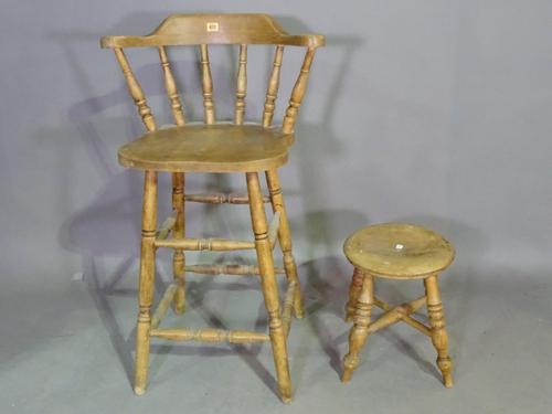 An early 20th century pine bar back stool and a pine circular stool on ring turned supports, (2). L5