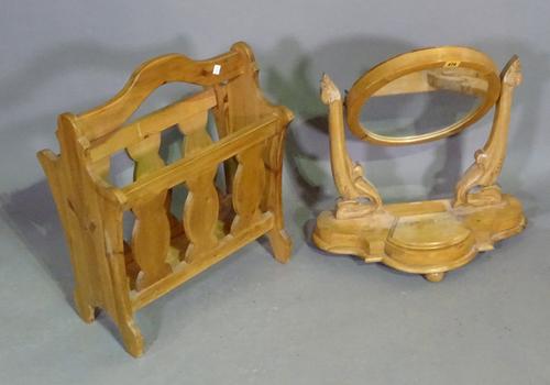A 20th century pine circular toilet mirror 50cm wide x 59cm high and a pine magazine rack, 45cm wide x 53cm high, (2).   BAY 2