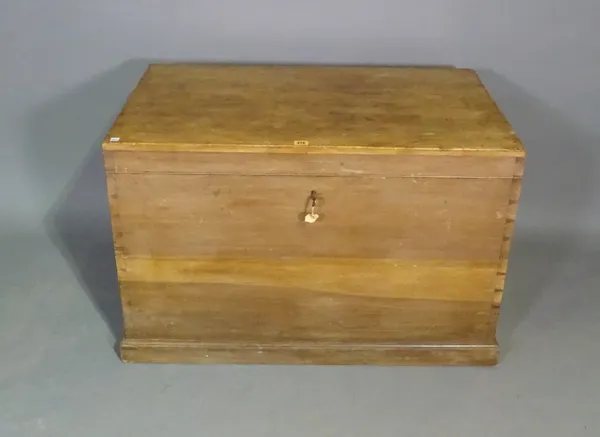 An early 20th century pine lift top trunk, 93cm wide x 61cm high.   J9