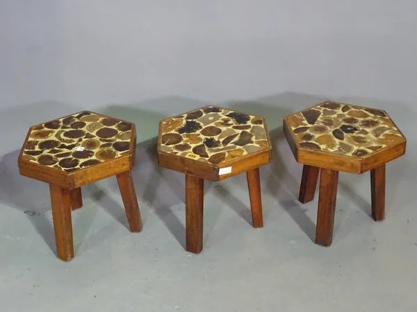 A group of three 20th century mahogany octagonal stools with yew wood oyster inlay on three downswept supports, 29cm wide x 30cm high.   H4