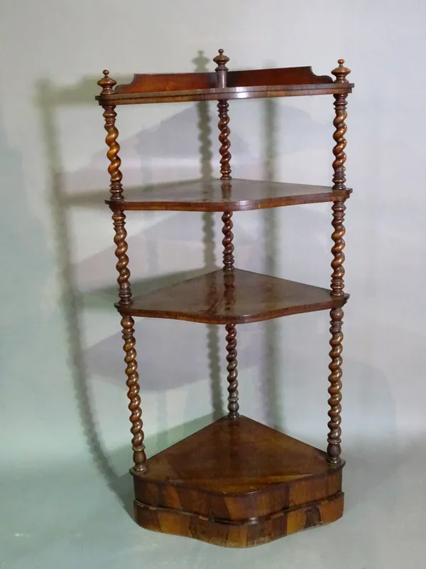 A Victorian rosewood four tier corner etagere on twisted column supports, 60cm wide x 133cm high.   F5