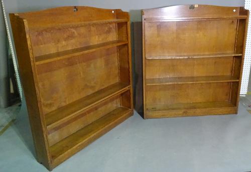 A pair of late 19th century Arts and Crafts oak five tier open bookcases, 107cm wide x 124cm high, (2).   E5
