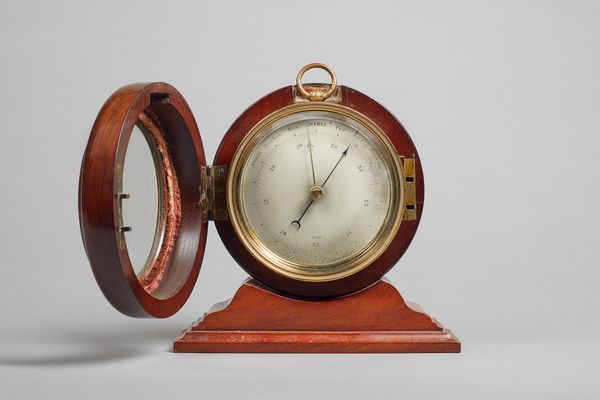 A Victorian mahogany-cased brass aneroid barometerNo. 12182The 4 1/4in. circular silvered dial, within an engine-turned bezel, brass suspension ring,