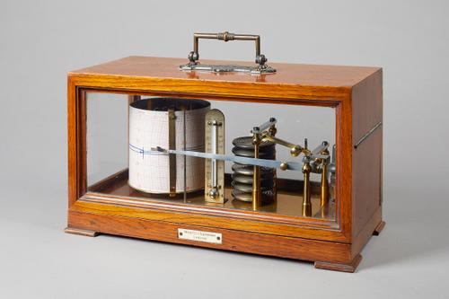 An oak cased barographBy Negretti & ZambraCirca 1900The rectangular case with a brass carrying handle and three glazed sides, the mechanism with seven