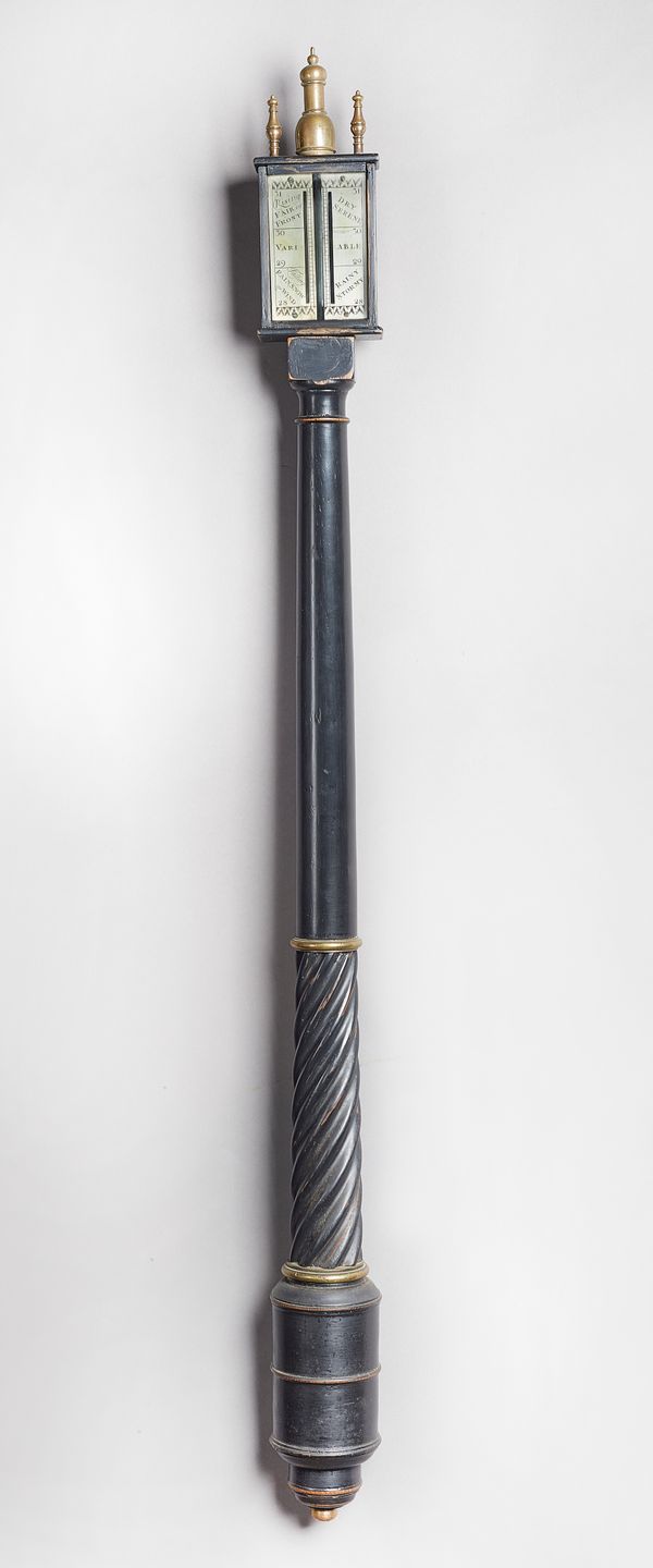 A brass-mounted ebonised stick barometerIn the late 17th Century styleSurmounted by three brass finials, with a silvered dial, above turned tapering c