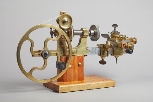 A brass and steel hand-driven watchmaker's latheSecond half 19th CenturyOn a later wooden base50cm wide