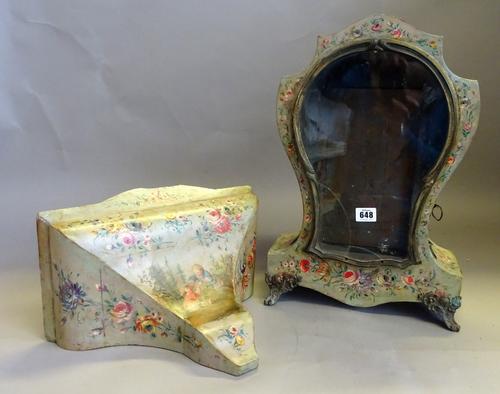 A Neuchâtel giltmetal-mounted clock case and bracketOf shaped outline, with a glazed door and polychrome decoratedThe clock 47cm high (2)