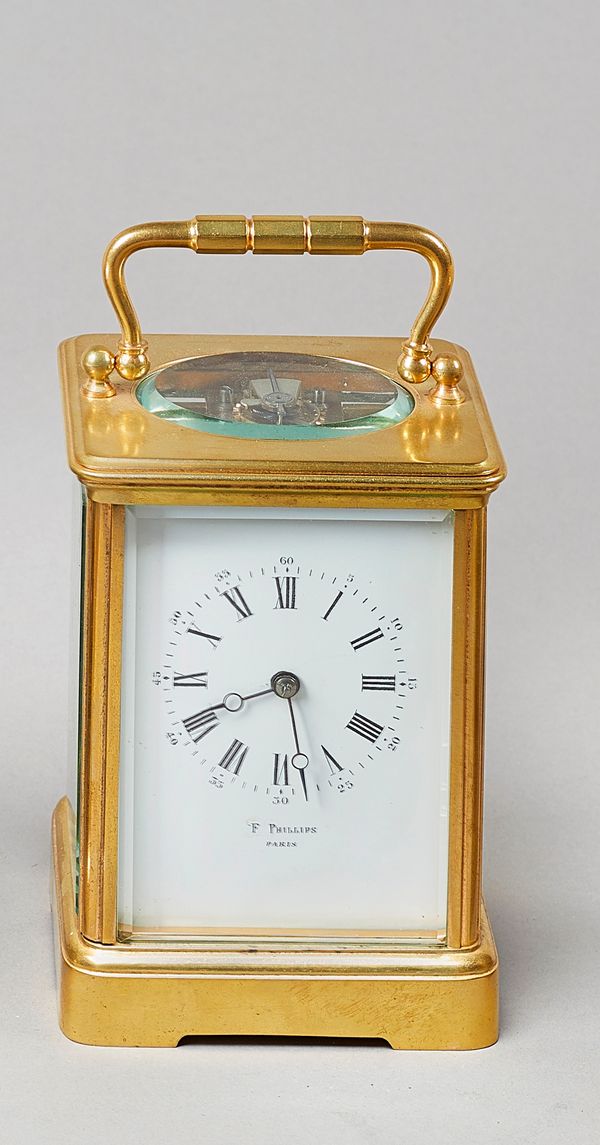 A French gilt brass carriage clockCirca 1900In an Anglaise riche case with fluted handle and flanked to each side by a Corinthian column, with brass d