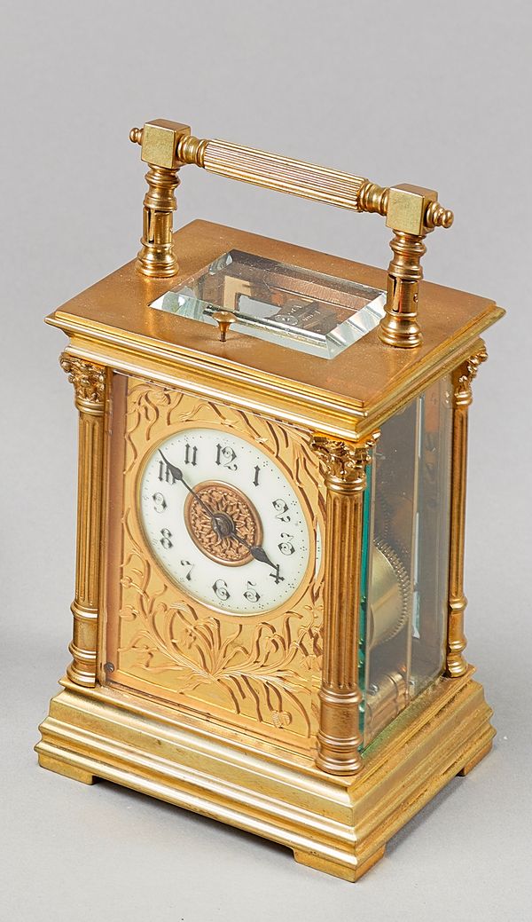 A French gilt brass carriage clockCirca 1890In a corniche case with an oval top glass, the white enamel dial inscribed F. Phillips, London, the twin t