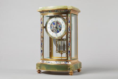 A French onyx and cloisonné enamel four glass mantel clockCirca 1900The bow-fronted case with bevelled glazed front, back and sides, the 4in. circular