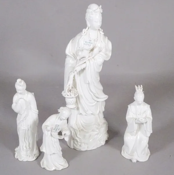Asian ceramics, a group of four 'blanc de chine' porcelain figures, largest 34cm high.  CAB