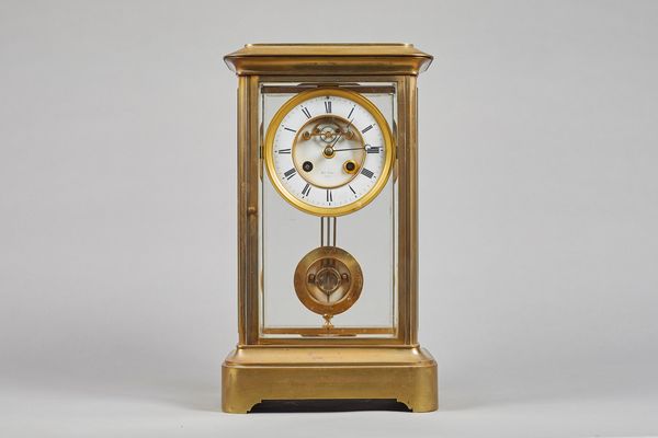 A French gilt-brass four glass mantel clockRetailed by Henri Marc, Paris, circa 1880The case with a stepped top and rounded corners, above bevelled gl