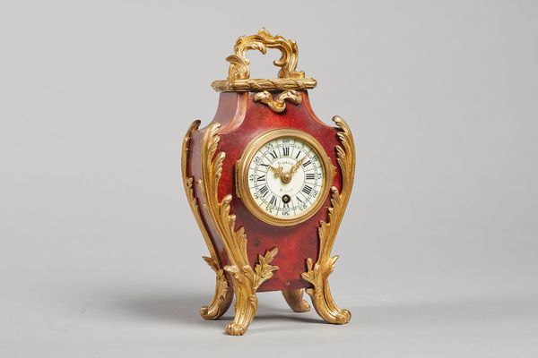 A French giltmetal-mounted tortoiseshell-mounted mantel timepieceIn the Louis XV style, circa 1890The case of shaped outline with 2 1/2 in. circular c