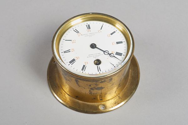 A French brass bulkhead timepieceRetailed by J. Calame A Paris, circa 1870The brass case with hinged glazed bezel, the white enamel dial inscribed Jul