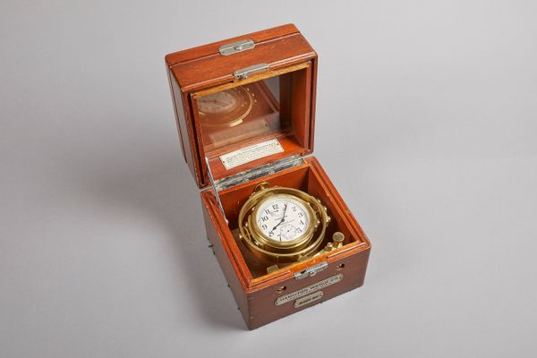 An American mahogany and nickel-mounted deck watchBy Hamilton Watch Co. Lancaster PA, No. 2f5342The three-tier case with hinged covers and glazed obse