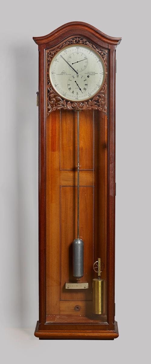 A Fine month-going mahogany wall regulatorBy Dent, London, No. 57740, circa 1912With an arched pediment above glazed front and sides, the 10 ½ in. cir
