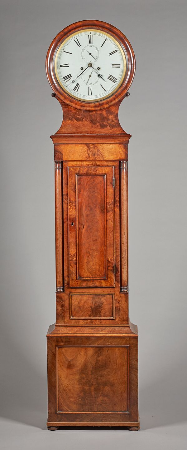 A Scottish William IV mahogany Drum head  longcase clockCirca 1840The circular pediment with a moulded glazed bezel, above a waisted neck, the trunk f