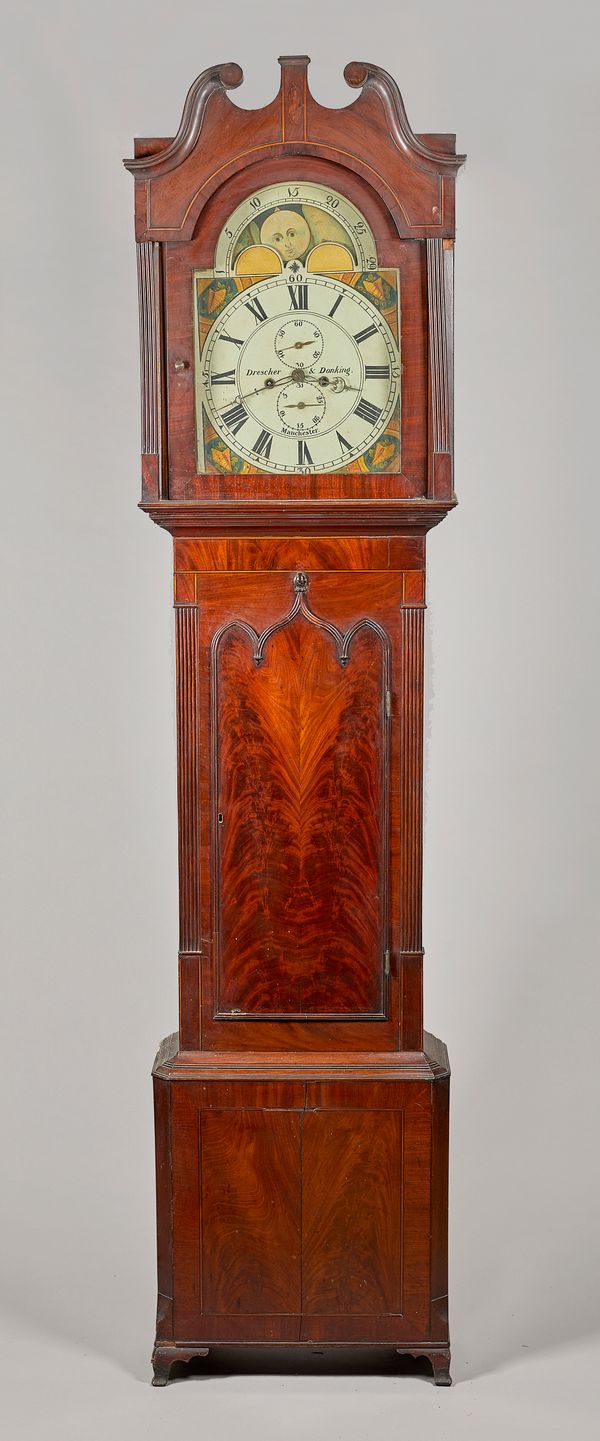 A late George III mahogany, ebony and boxwood-outlined longcase clockBy Drescher & Dorking, Manchester, circa 1810The swan neck pediment, inlaid with