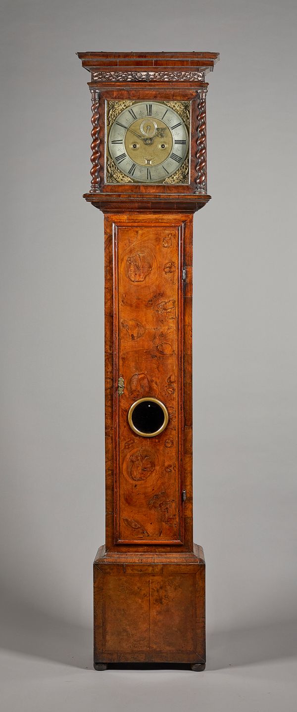 A Queen Anne walnut Longcase clockBy John Trubshaw, London, early 18th Century and laterThe rising hood with a moulded pediment above a fret panel, wi