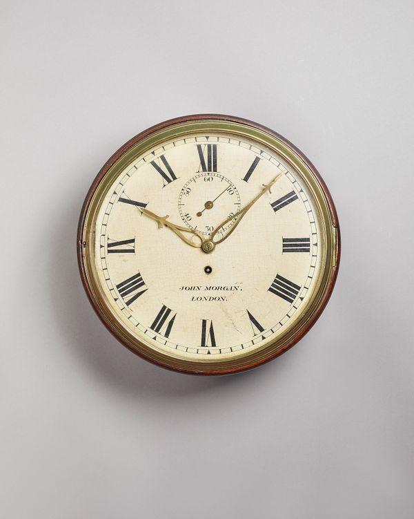A George III mahogany dial timepieceBy John Morgan, LondonWith cast-brass bezel and 12in. painted wooden dial, unusually with seconds subsidary and pi