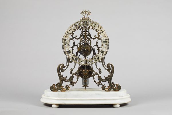A Victorian brass skeleton timepieceCirca 1890The finely-pierced plates of arabesque design, with turned pillars, screwed to each end, chain fusée wit