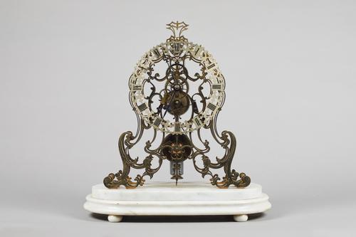 A Victorian brass skeleton timepieceCirca 1890The finely-pierced plates of arabesque design, with turned pillars, screwed to each end, chain fusée wit