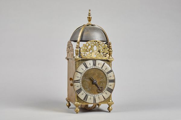 A brass lantern clockBy Henry Lintott, Farnham, 18th Century and with later elementsSurmounted by a bell, with four straps and five turned finials, th