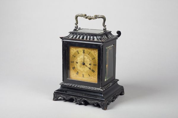 An ebonised table clock, in the Chinese tasteBy James McCabe, Royal Exchange, London, No. 12203, circa 1850The case of stylised pagoda form, surmounte