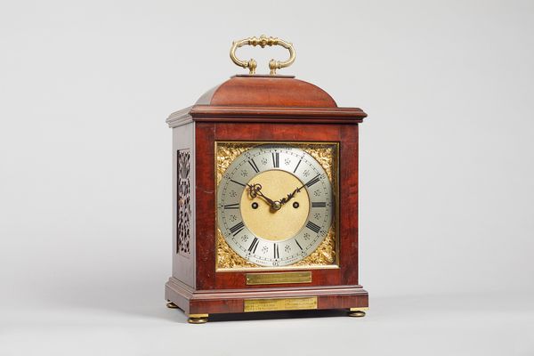 An Edwardian mahogany bracket clockBy Payne & Co. 163 New Bond Street, London No. 2042, circa 1918The case with a caddy top and gilt-brass handle, wit