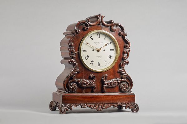 A Victorian mahogany bracket clockBy James McCabe, Royal Exchange, London, No. 2045The case of shaped outline with foliate carving, cast-brass bevelle