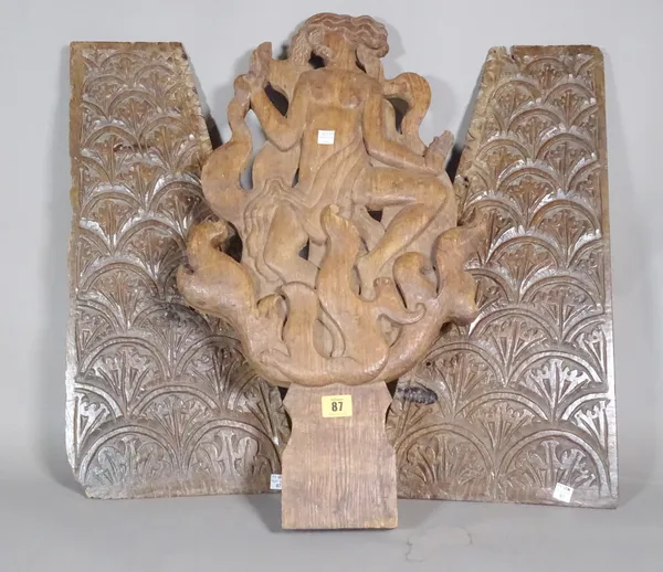 A carved wooden plaque depicting a deity and three further carved panels, the largest 67cm tall (4).   S4M