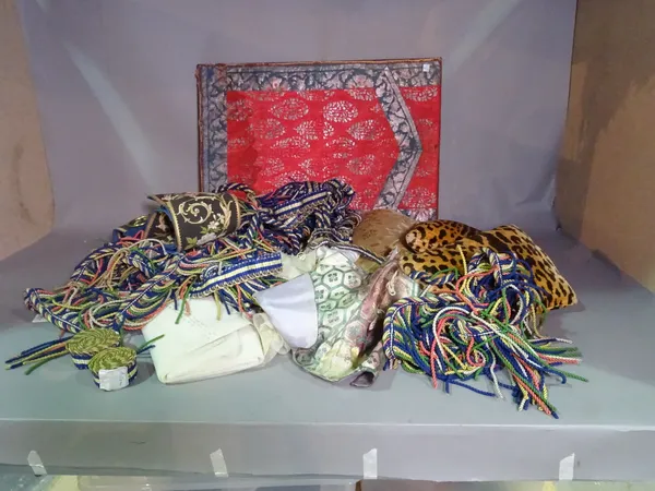 Textiles including; a stretched patterned panel, lace panels, leopard print cushions, tassels and sundry, (qty).    CAB
