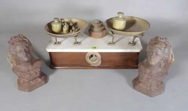 A set of early 20th century walnut and marble balance scales and a pair of fire dogs modelled as female busts, (3).   S4M