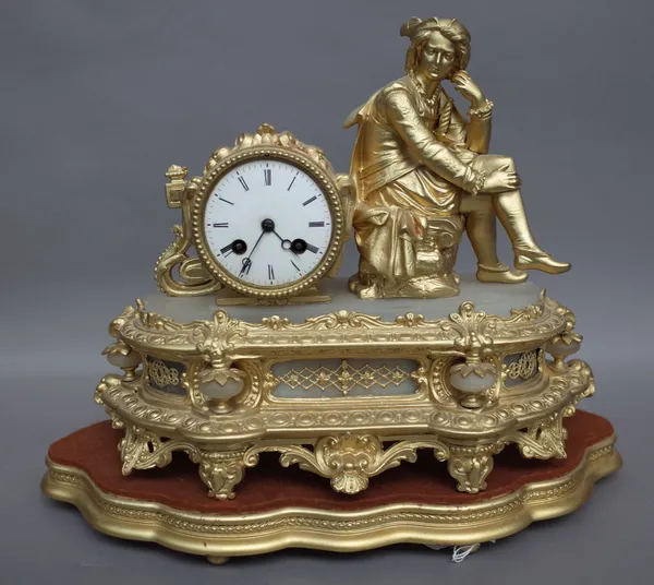 A Louis XVI style gilt metal and alabaster figural mantel clock, circa 1900, surmounted with a classical seated male alongside a circular drum case en