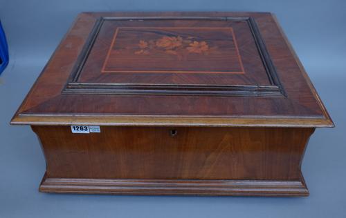 A Swiss walnut cased polyphon with 15.5inch metal discs, case 53cm wide. (three discs)