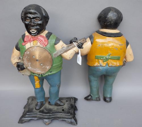 A Bradley & Hubbard "Sambo" cast iron blinking eye clock, case 19th century, on a shaped base. (40cm high) (lacking movement and internals)