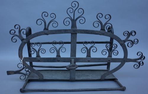 A late 17th century Scottish wrought iron Bannock or scone toaster, (a.f.), 55cm wide, (see J. Seymour Lindseys book figure 141 for similar).