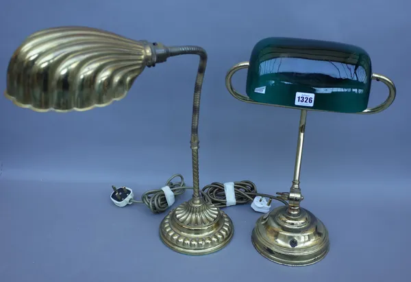 An Edwardian style gilt metal adjustable desk lamp with green glass shade and a stepped circular loaded base and one further gilt metal adjustable des