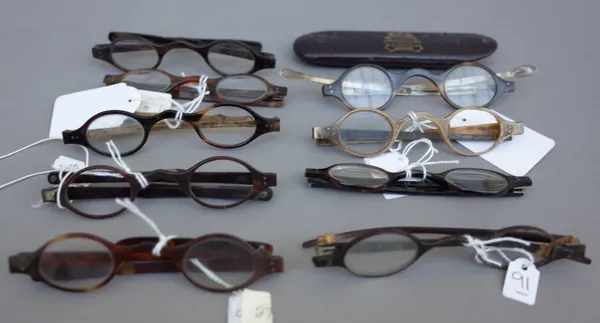 Nine pairs of tortoiseshell spectacles with oval lenses, 19th century,  four with turn pin arms, (9).