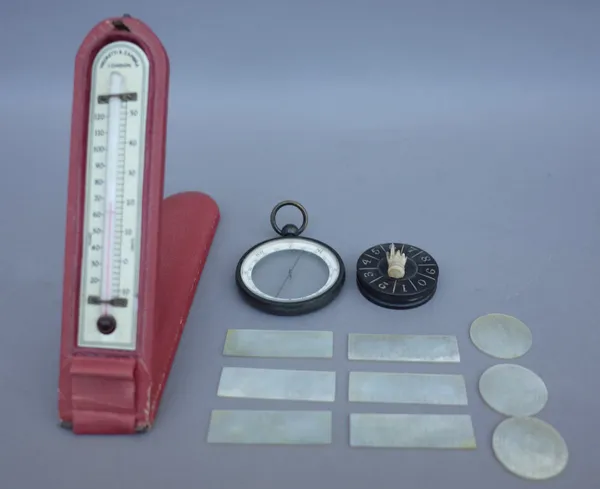 A Negretti and Zambra ivorette thermometer, cased, an unusual compass, cased and a small quantity of Chinese mother of pearl gaming counters. (qty)