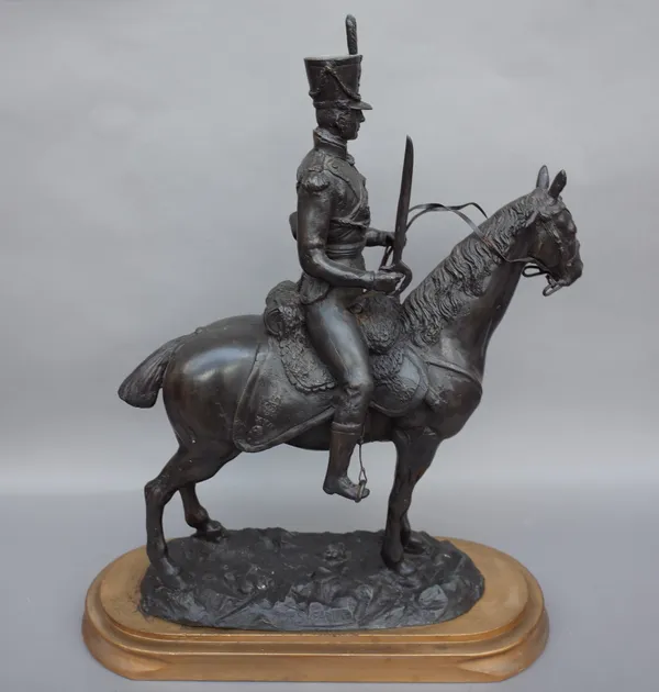 A modern bronze Hussar on horseback, signed to the cast 'T. R. Skeaping' on a naturalistic base and stepped giltwood plinth, 56cm high.