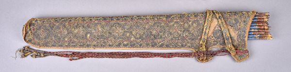 A Persian embroidered cloth quiver, early 19th century, foliate detailed with straps enclosing seventeen tipped wooden arrows, 66cm, with associated c