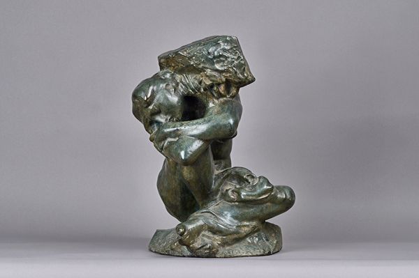 A  verde patinated bronze female nude, early 20th century modelled seated, supporting a rock on her shoulders, unsigned. 42cm high. Illustrated