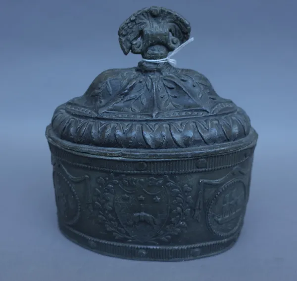 An 18th century pewter tobacco box and cover, possibly Leeds, embossed decoration of hanging sheep against an oval body (16cm wide), an 18th century b