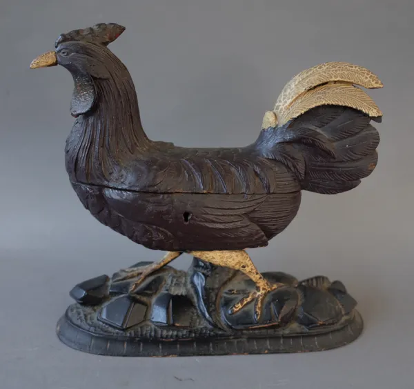 A Black Forest carved wooden novelty 'Chicken' jewellery casket, late 19th century, the hinged lid opening to reveal a silk lined cushioned interior,