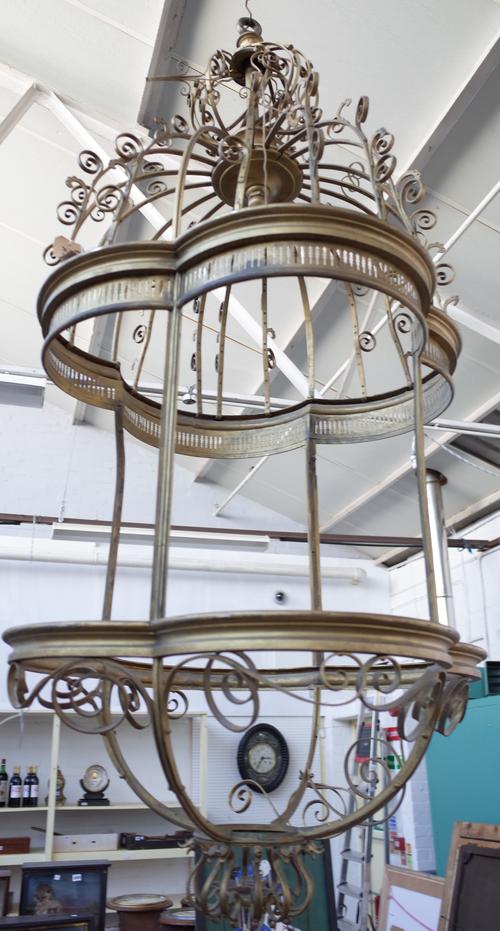 A gilt bronze and metal mounted lantern of large proportions, modern, of quadralobe form with scroll work decoration to the domed ends. (a.f.) (lackin