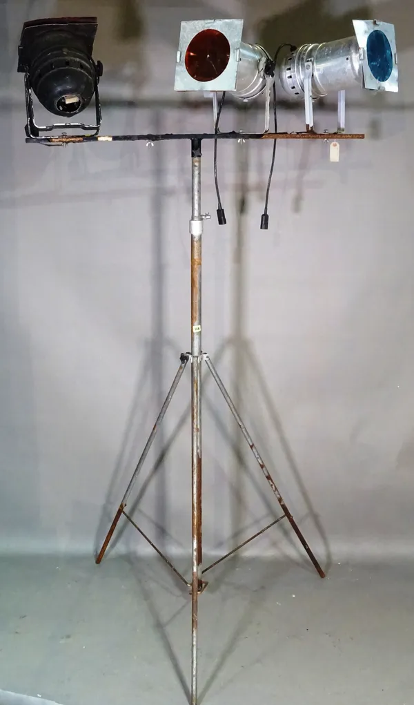 A large theatrical light stand fitted with three theatre lights.  H5